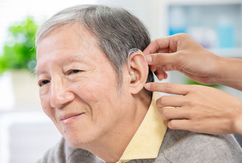 man getting fitted for hearing aids